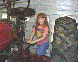daughter helping work on tractor