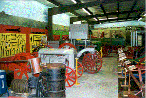 warehouse with barrels tractors ad wrenches