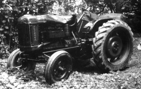 Fordson F in bad shape, hood smashed by tree